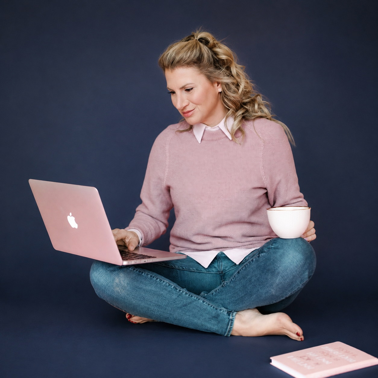 Krista Rose working on a laptop